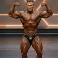 MetroMaleWear MetroMuscleWear black shower competition briefs with a gold bull emblem on the front