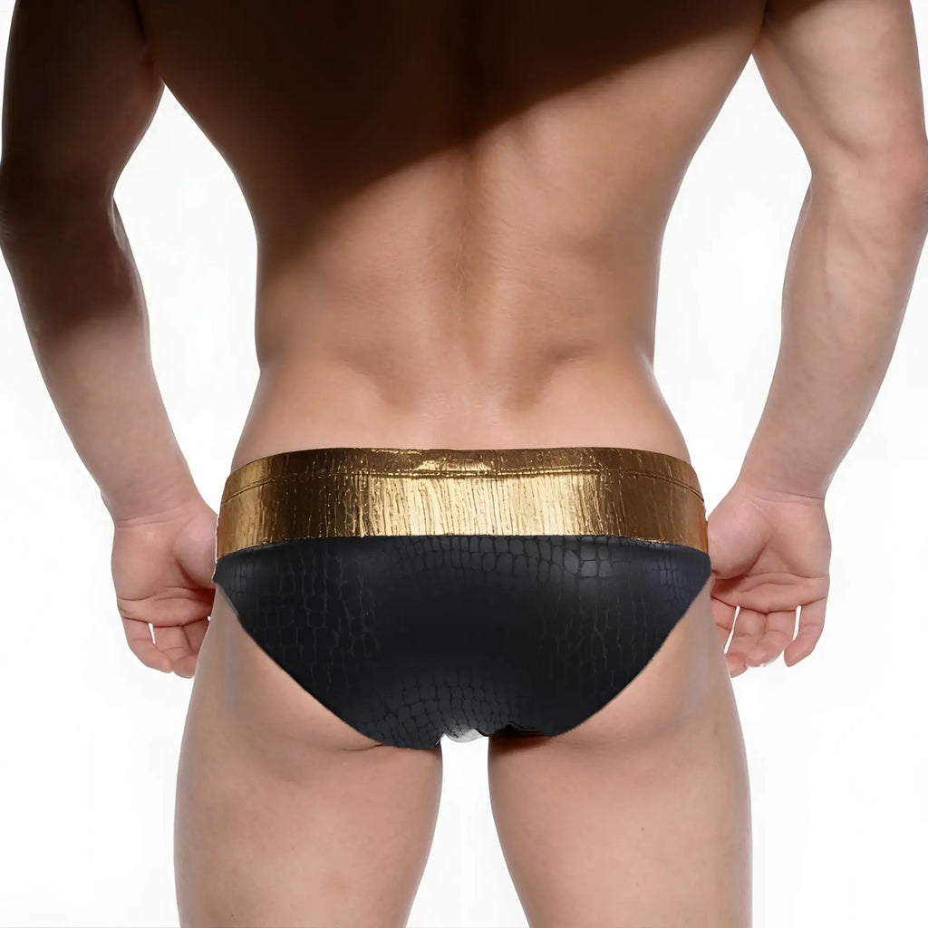Black swim trunks with textured crocodile pattern and shiny gold waistband metroMaleWear Fortuna competition suit