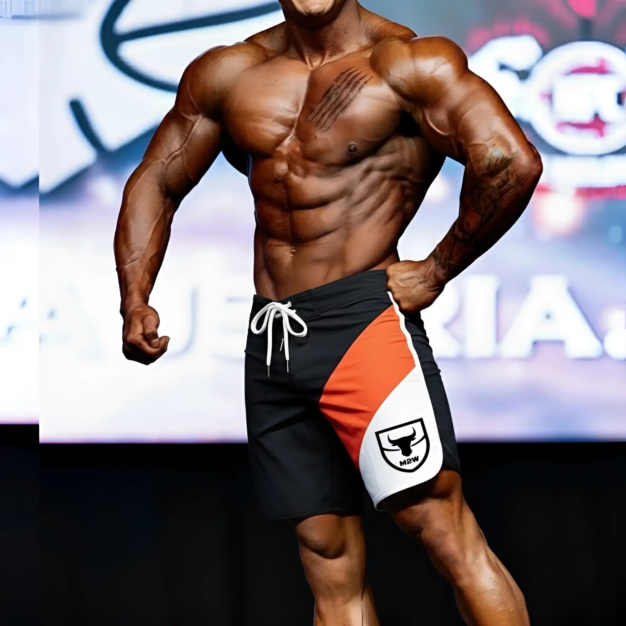 Black orange and white metromalewear metromusclewear ifbb pro mens physique board shorts with bull logo and white drawstring