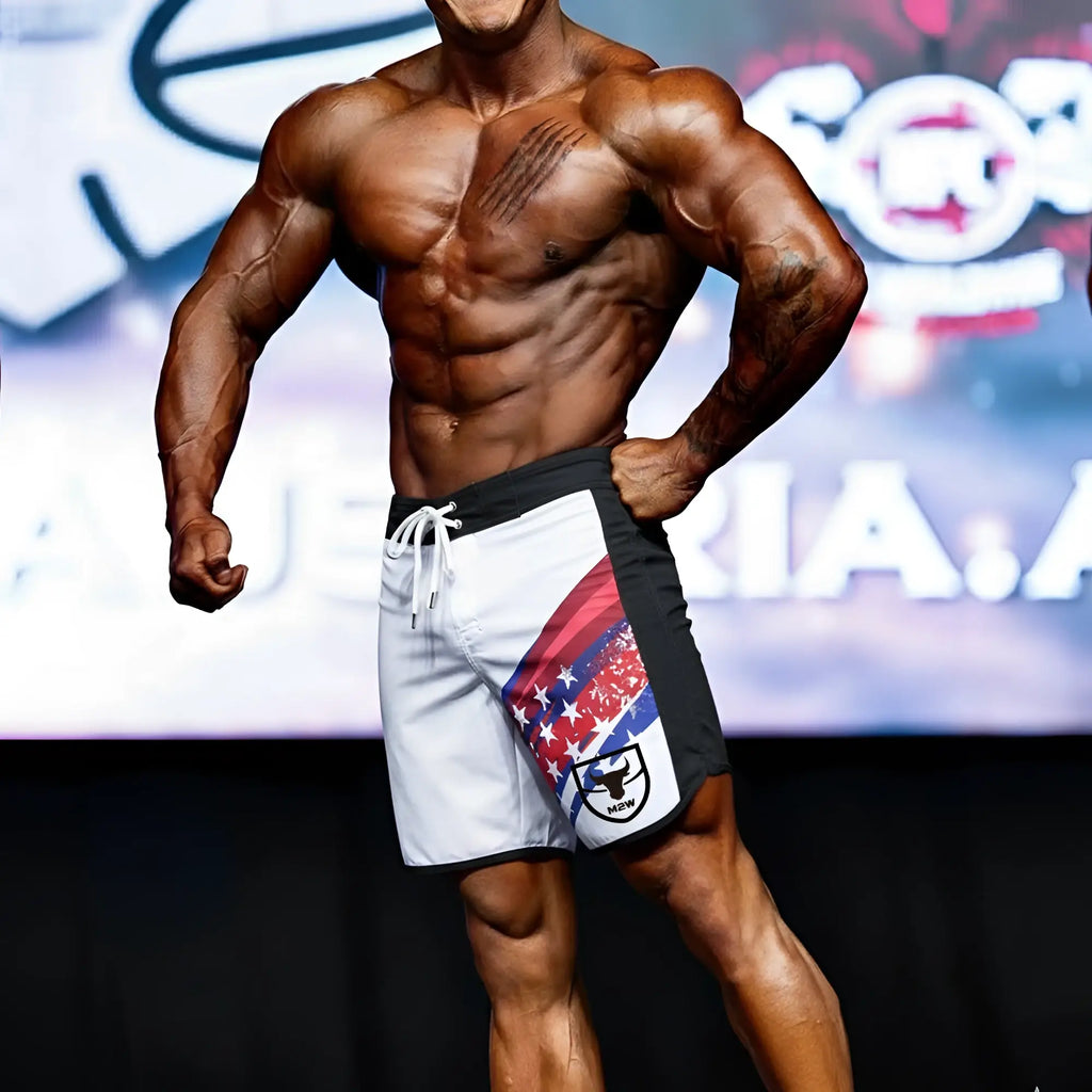 White and black MetroMuscleWear IFBB Pro men’s athletic shorts with red white and blue star stripe and black bull logo