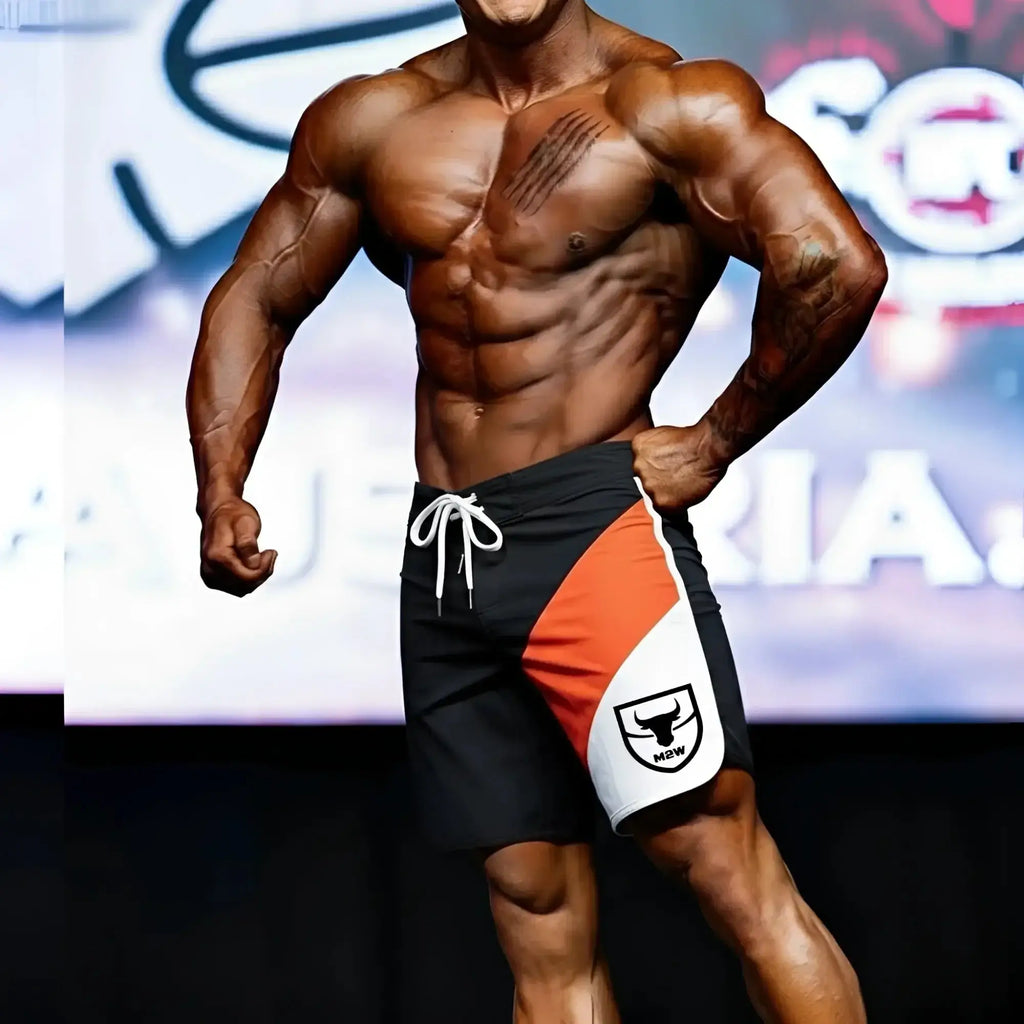 Black orange and white metromalewear metromusclewear ifbb pro mens physique board shorts with bull logo and white drawstring