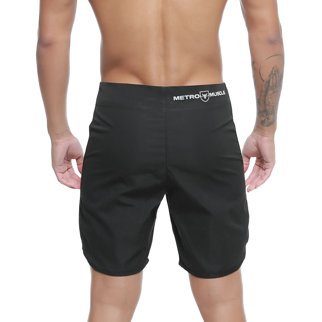Black metro muscle men’s shorts with sleek athletic cut and subtle white branding on waistband by metro malewear