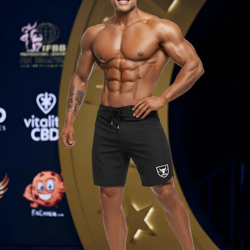 Black MetroMaleWear MetroMuscleWear Intenso Physique board shorts with white shield logo and drawstring waistband