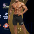 Black MetroMaleWear MetroMuscleWear Intenso Physique board shorts with white shield logo and drawstring waistband