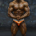 Orange athletic briefs with gray waistband and white logo metro malewear metromusclewear muscle trunk ochre 4700-14