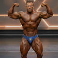 Blue MetroMaleWear MetroMuscleWear competition briefs with a gold bull logo designed for athletic performance