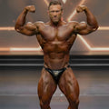 Black leather briefs with gold emblem and metal rings from MetroMaleWear MetroMuscleWear Tony Competition Suit 4974-14