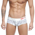 White briefs with black geometric moustache pattern and red arrow logo on waistband.
