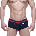 Navy blue MetroMaleWear Micro Mini Boxer briefs with red trim and a white logo on the waistband