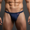 Navy blue MetroMaleWear modern pouch thong for men with red brand tag on waistband highlighting comfort and style