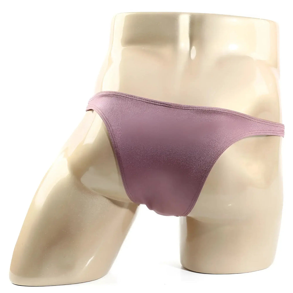 A shimmering mauve satin thong from metro male wear monaco bikini lilac 6010-03 displayed on a mannequin
