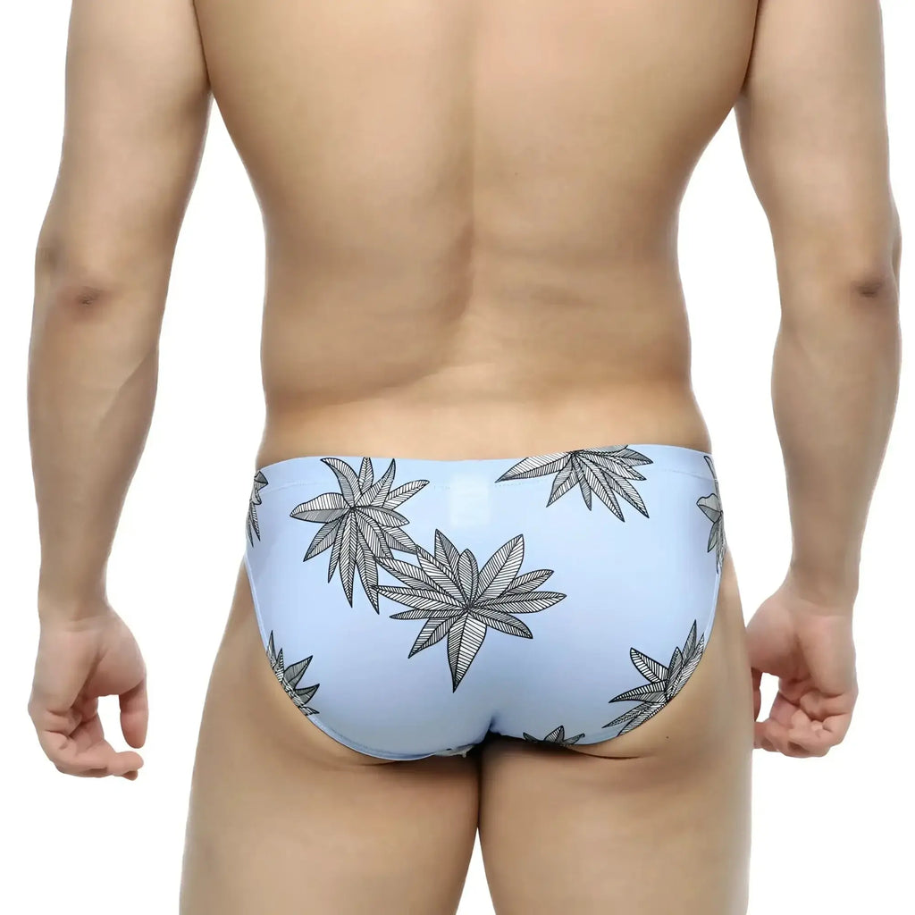 Light blue metroMalewear palma bikini 5103-49 swim trunks with bold black leaf pattern for casual beachwear