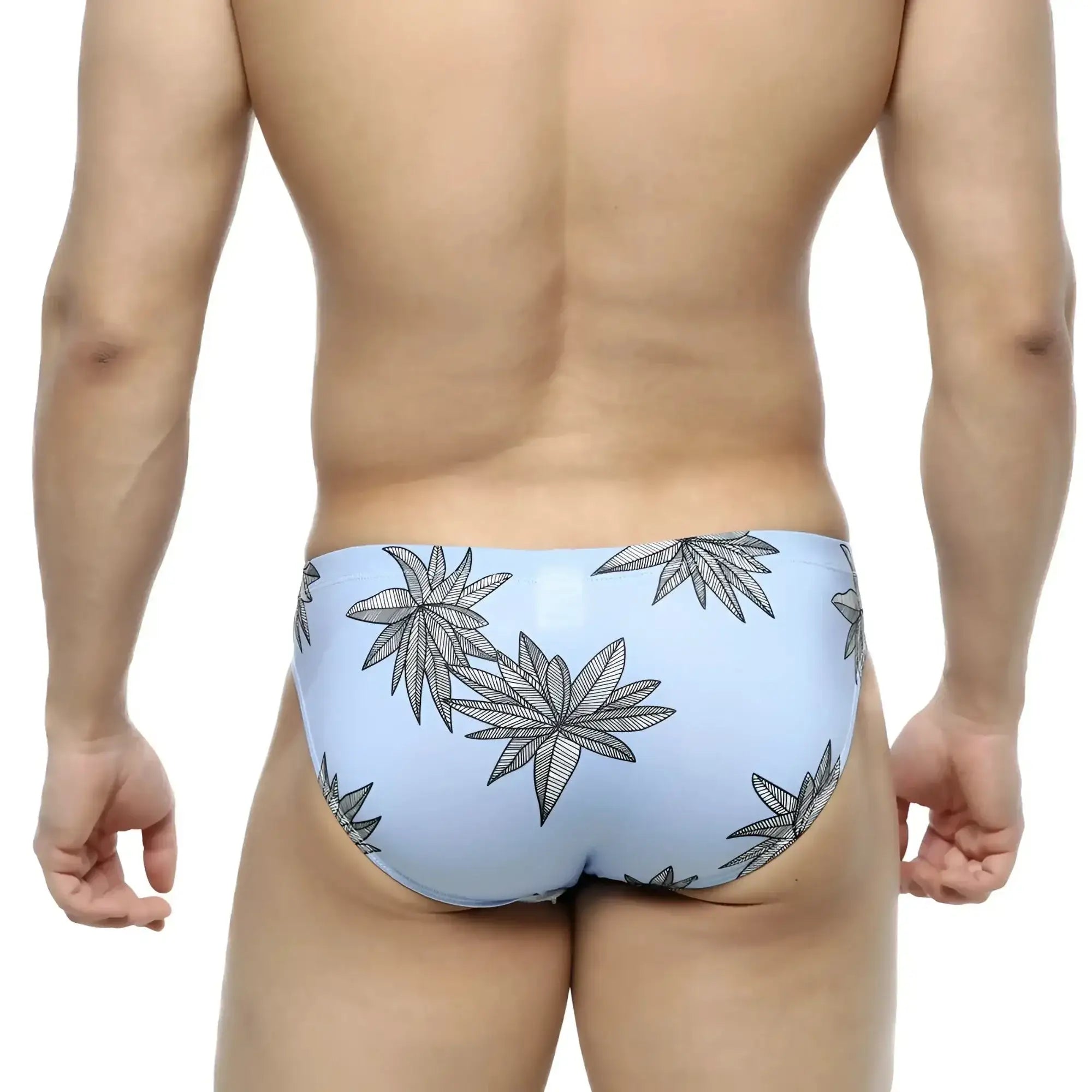 Light blue metroMalewear palma bikini 5103-49 swim trunks with bold black leaf pattern for casual beachwear