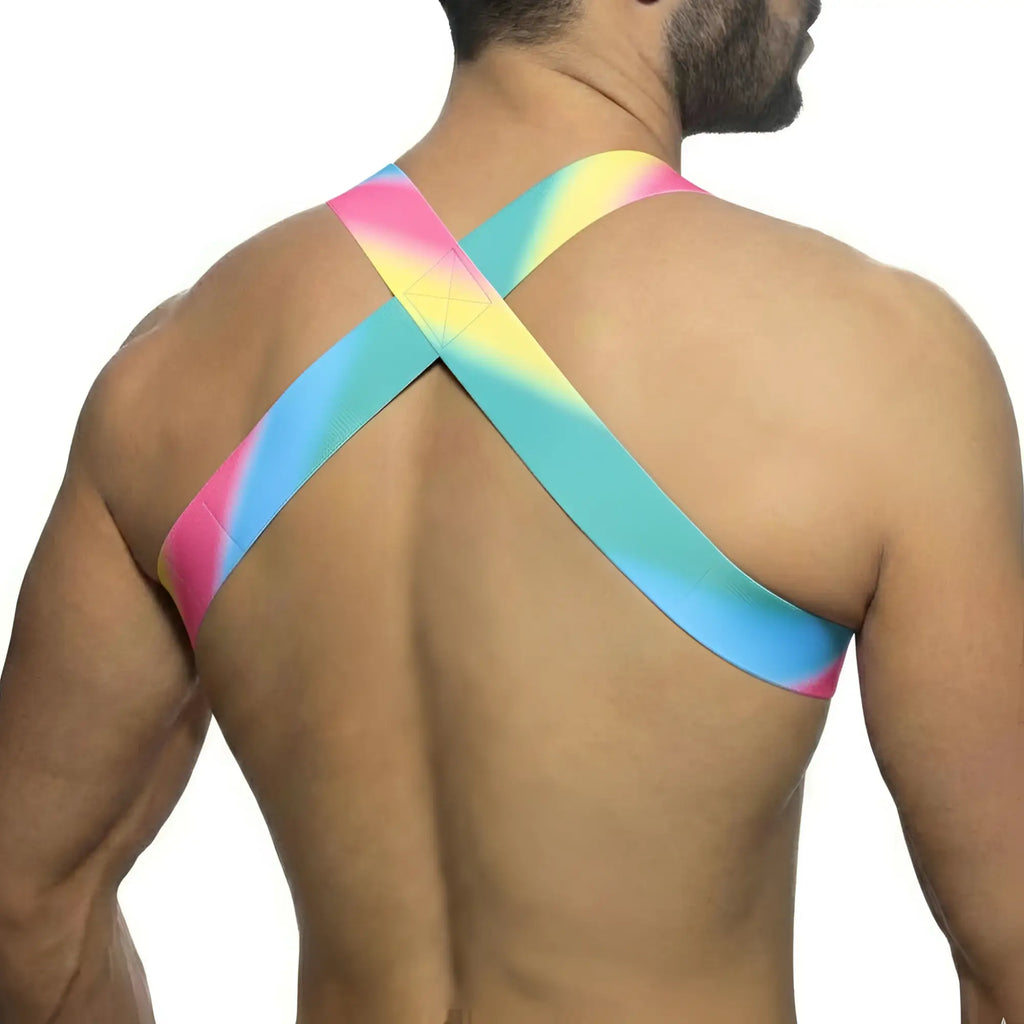Vibrant rainbow-colored crossback sports bra by metromalewear with smooth stretchy fabric and pastel harness design