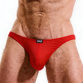 Red form-fitting cotton thong bikini with black logo patch at waistband from MetroMaleWear Perfect Scene line