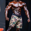 MetroMaleWear physique board short green camo with black drawstring waistband and logo patch on lower right leg