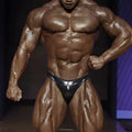 Black shiny latex briefs from metro malewear posingwear metallic navy posing suit shown from the back side