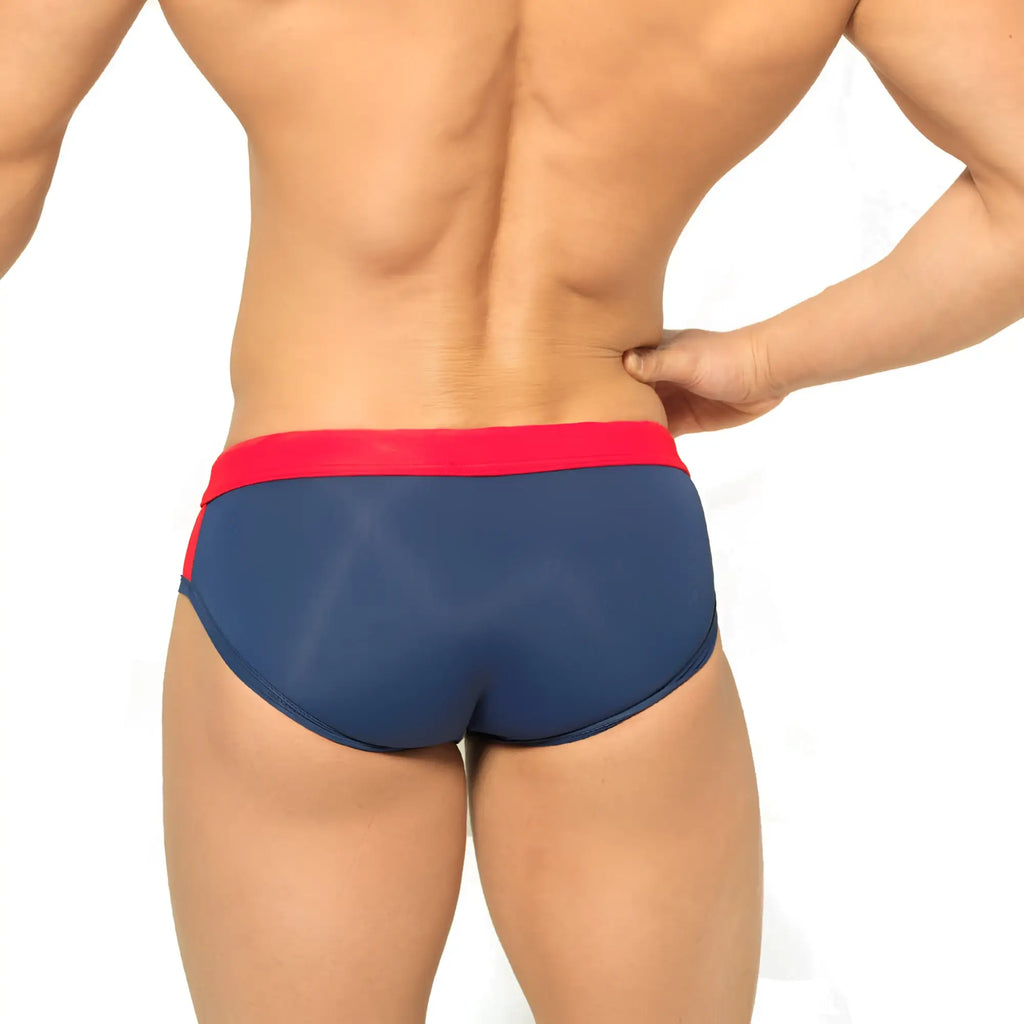 MetroMalewear reno swim brief navy 4962-28 features navy blue fabric with a bold red waistband and side trim