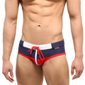 Navy blue and red metro malewear reno swim brief with white trim and red drawstring for swimming and beachwear