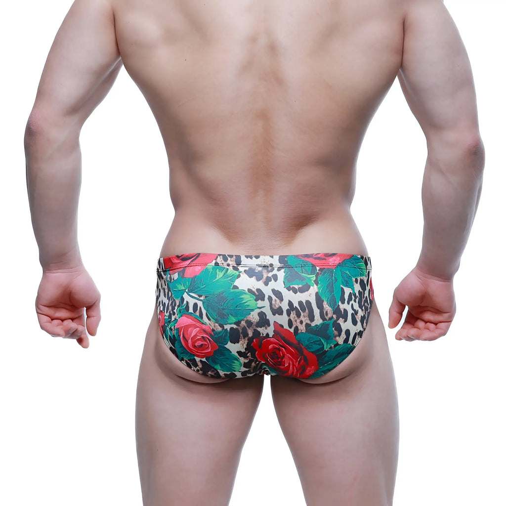 MetroMaleWear Rosee Bikini 5103-M81 leopard print swim trunks with vibrant red roses and lush green leaves design
