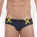 Navy blue MetroMaleWear Scottish swim brief with bold yellow x-shaped straps and a black bow at the front