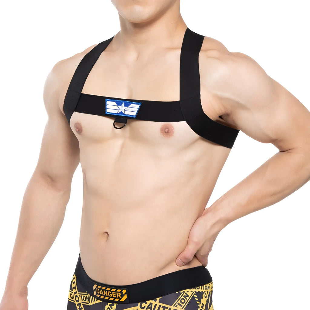 Black fabric metroMalewear sergant harness with blue and white star emblem on chest strap for stylish support