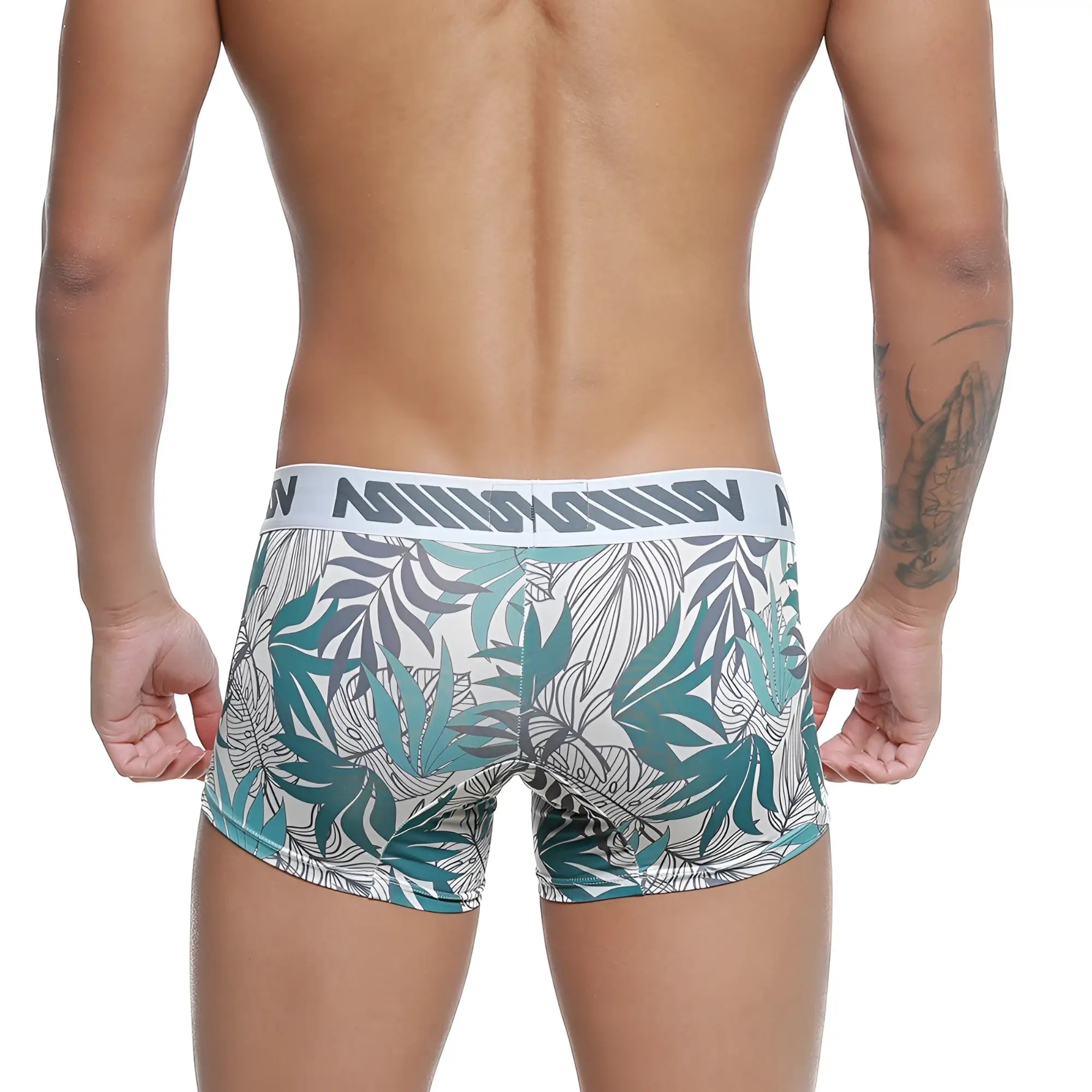 Men’s tropical leaf-patterned boxer briefs in teal gray and white with branded elastic waistband by MetroMaleWear