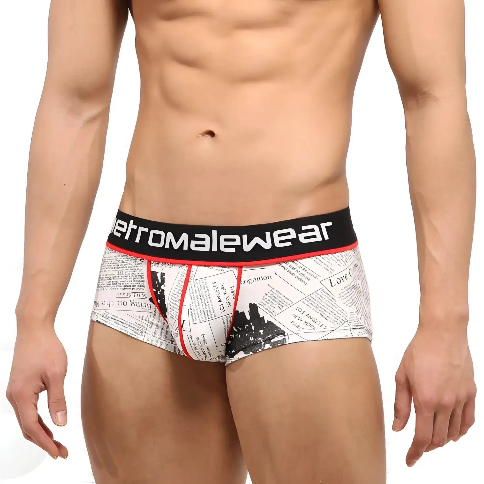 White briefs with newspaper print and black red trim featuring retromalewear brand on waistband.