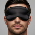 Black satin sleep mask with smooth glossy finish and elasticized edges by MetroMaleWear for comfortable night use
