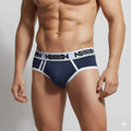 MetroMaleWear Sistonia hip brief in navy blue and white with a bold black logo waistband designed for athletic use