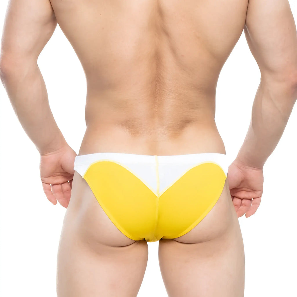 Yellow and white MetroMaleWear splash swim bikini briefs with bold heart-shaped design for athletic use