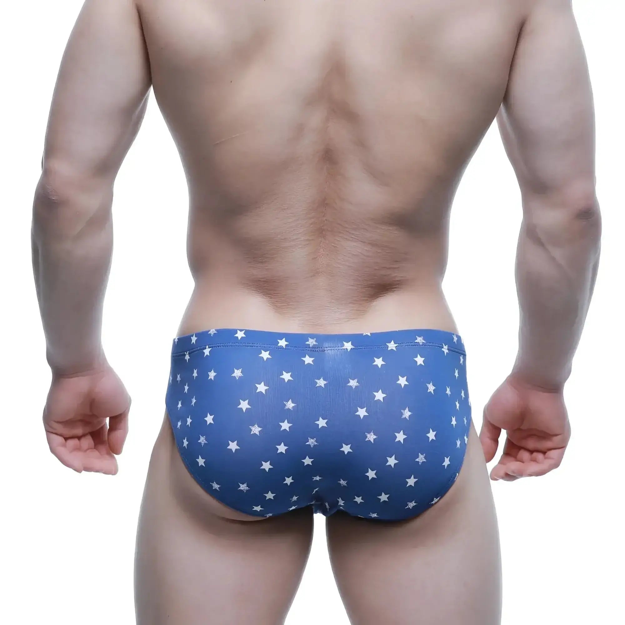 Blue swim trunks with a white star pattern from MetroMaleWear Stella hip brief 5123-90 collection