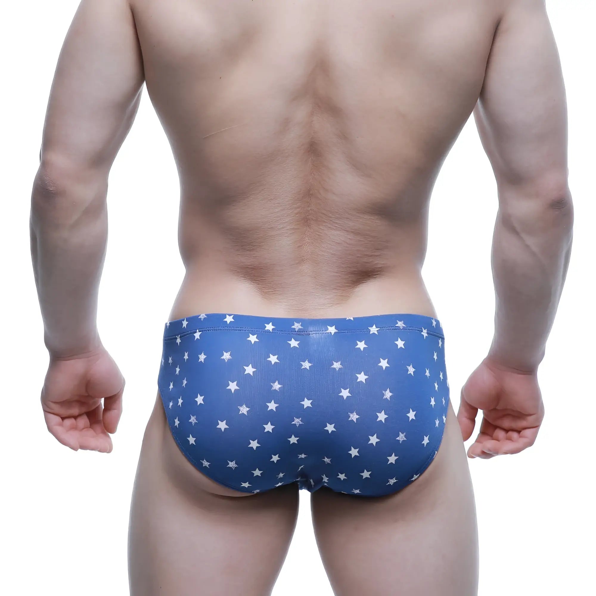 Blue swim trunks with a white star pattern from MetroMaleWear Stella hip brief 5123-90 collection