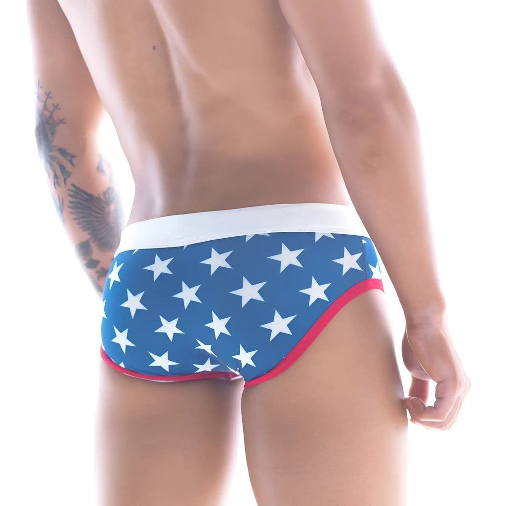 Blue swim trunks with white stars and red trim metro male wear stella swim brief 4916-92 front view
