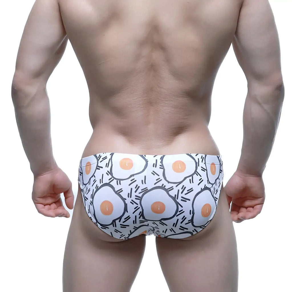 MetroMaleWear sunny side bikini white swim trunks with playful cartoon fried egg pattern and black outline accents