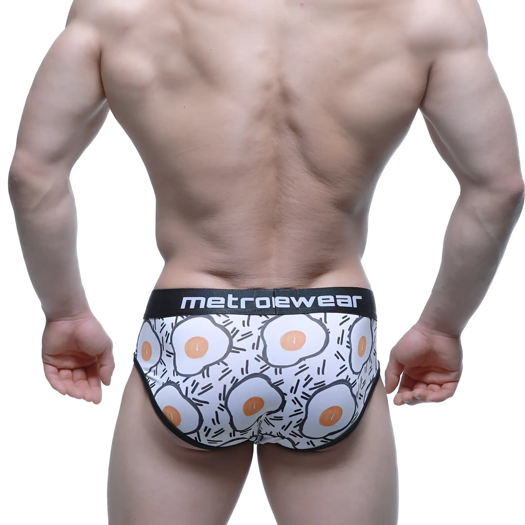White briefs with a playful fried egg pattern in orange and black and metroewear branded waistband MetroMaleWear Sunny Side Brief 5203-64
