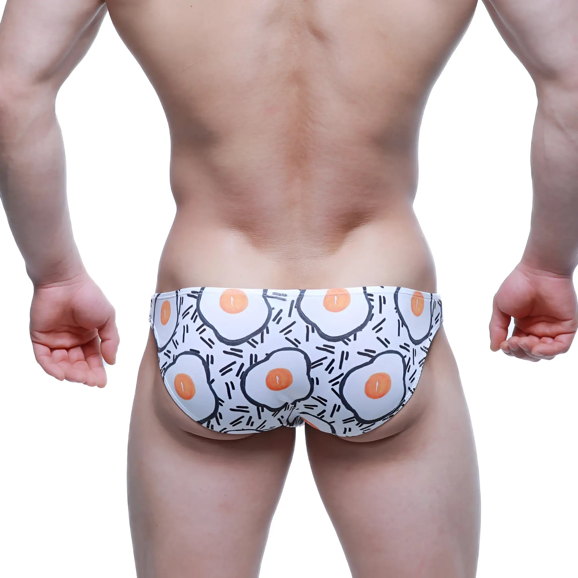 White swim trunks by metromalewear with playful fried egg pattern and black line accents sunny side lowrise bikini 6115-67