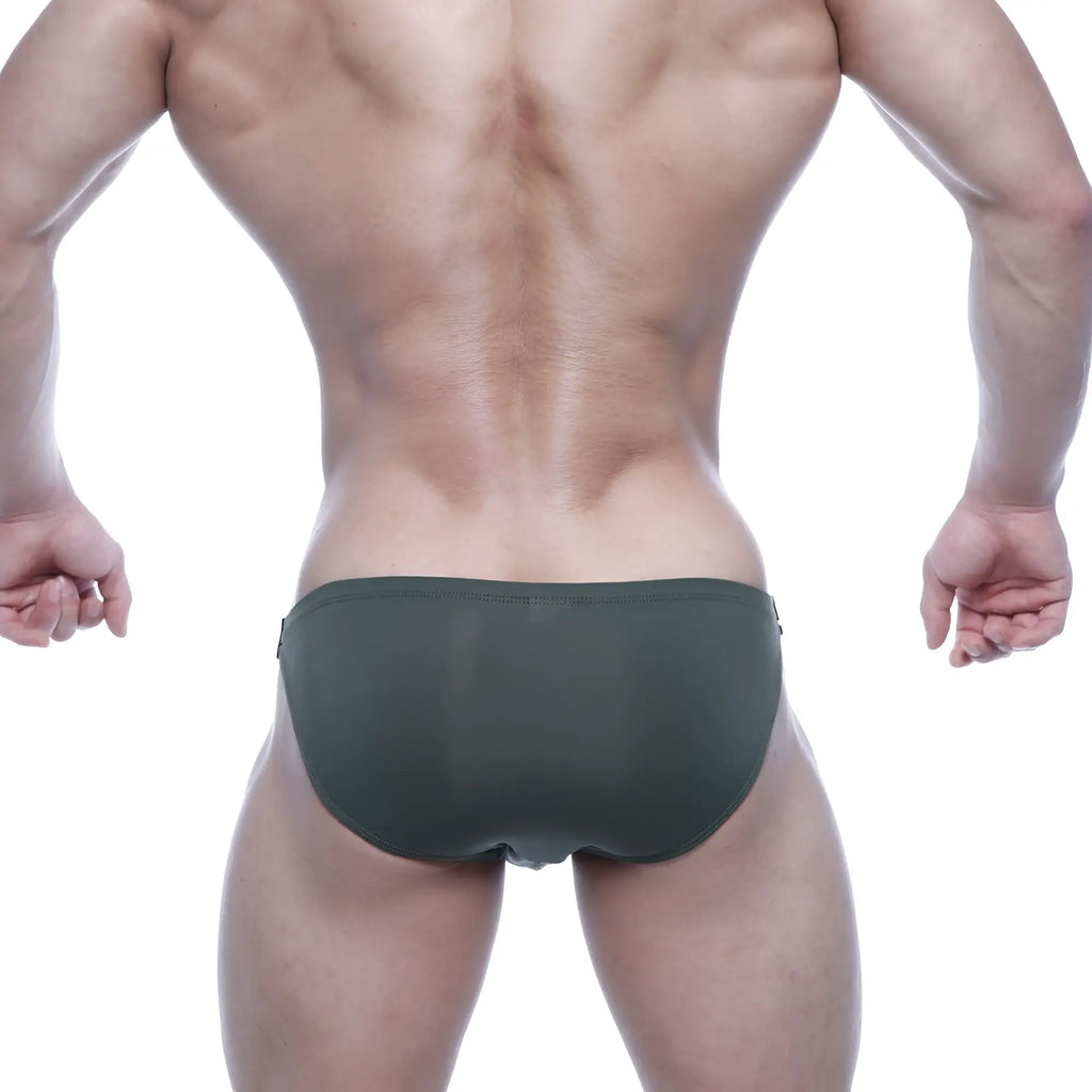 Dark green form-fitting swim trunks by MetroMaleWear featuring smooth stretchy fabric for comfortable wear
