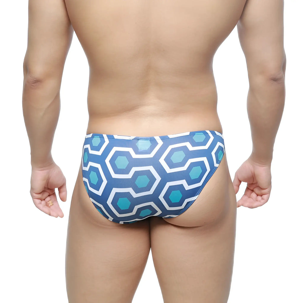 Blue and white geometric patterned swim trunks with retro hexagonal print from metromalewear super lowrise bikini line