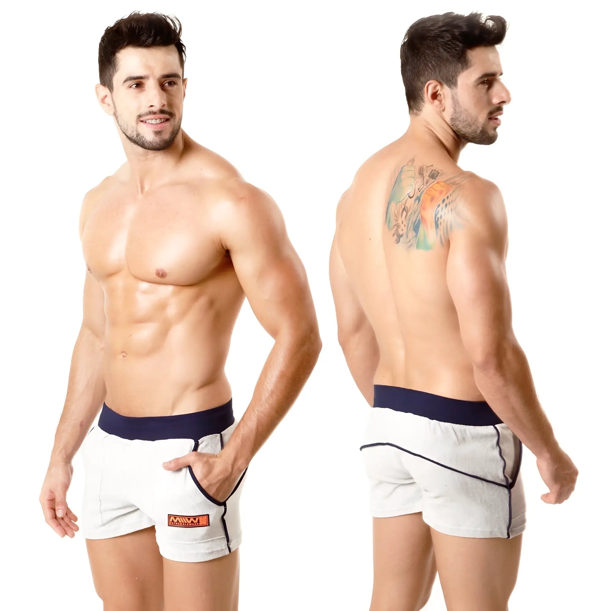 White terry sport shorts with navy waistband and trim featuring a small orange logo from metromalewear
