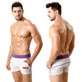 White MetroMaleWear terry sport shorts with purple waistband trim and orange logo on the side