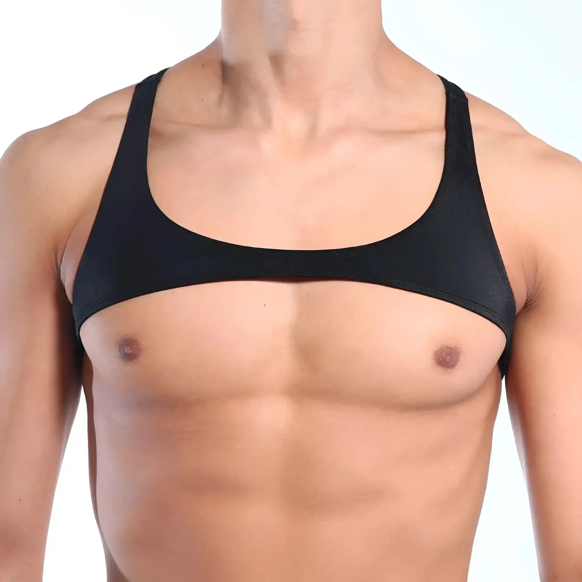 Black form-fitting MetroMaleWear tank top with wide shoulder straps and scoop neckline visible from the back side