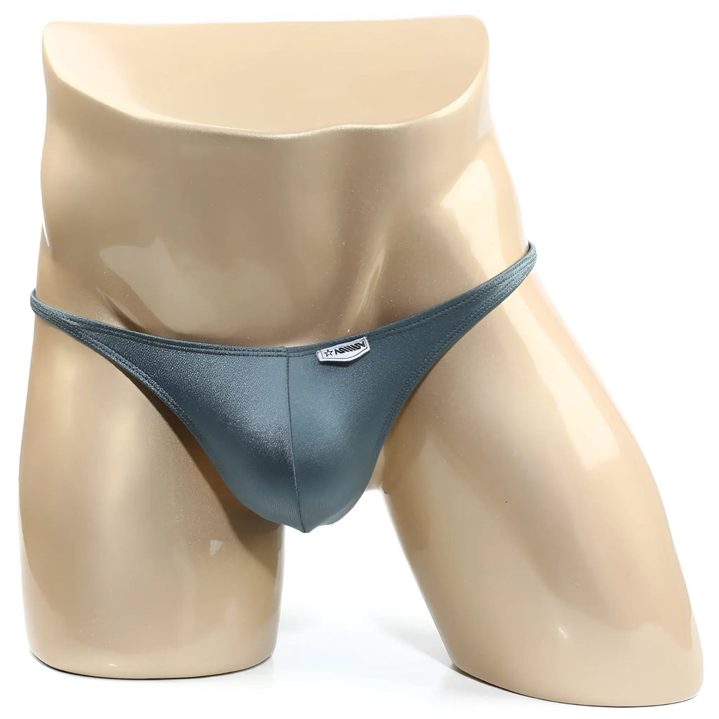 A sleek dark teal satin thong bikini with subtle sheen and silver logo tag from MetroMaleWear TROZO BIKINI green 6126-07