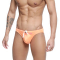 Orange swim trunks with white drawstring and pink brand tag from metro malewear vanguard swim bikini collection