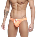 Orange swim trunks with white drawstring and pink brand tag from metro malewear vanguard swim bikini collection