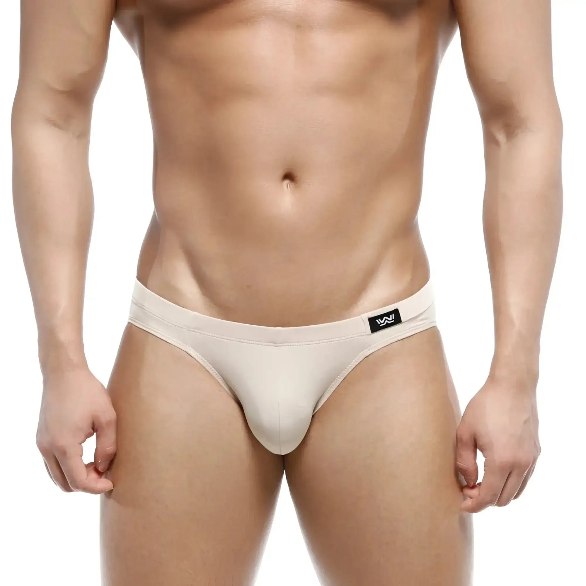 Beige metroMalewear Vasco hip brief men’s thong with black logo tag on waistband in soft fabric
