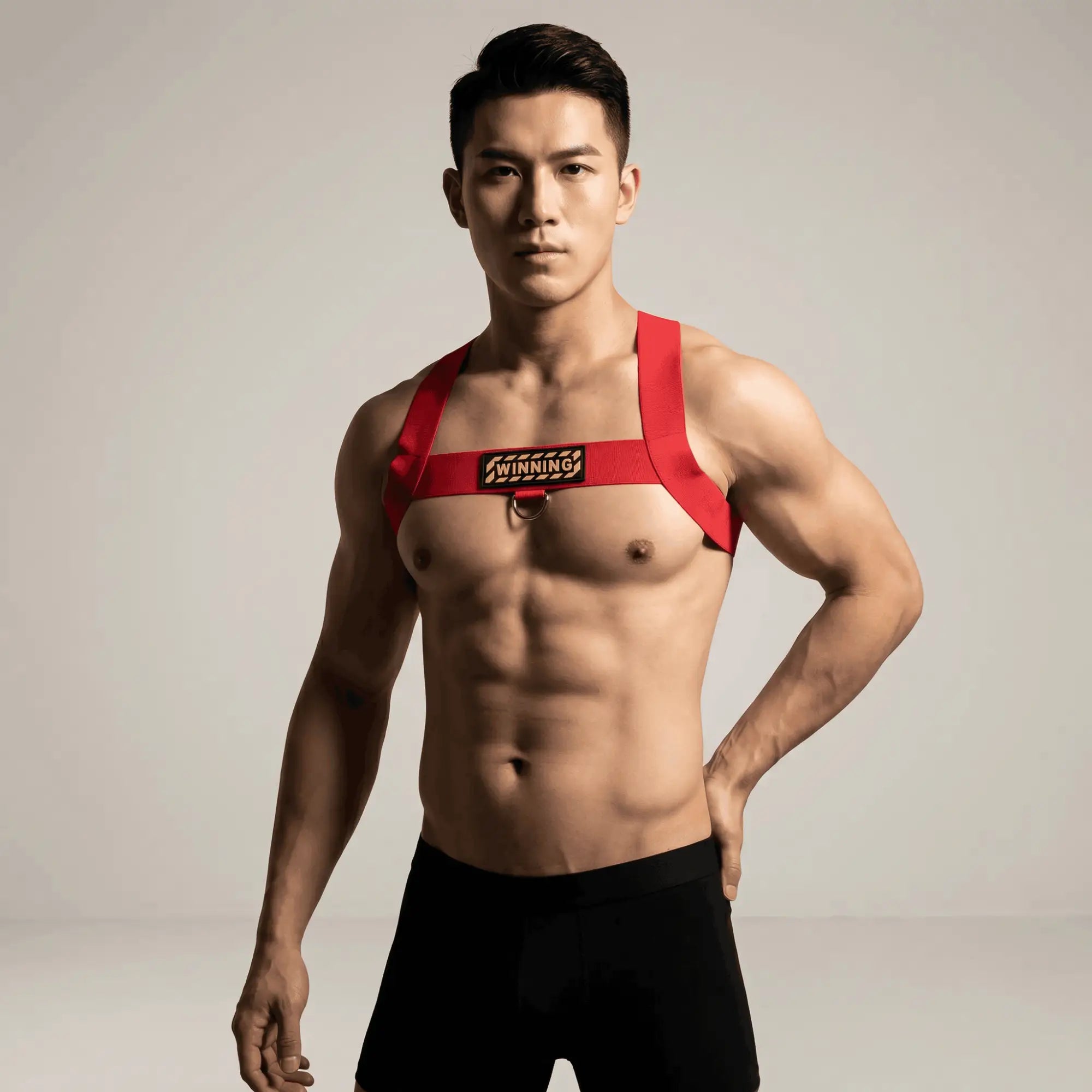Athletic man wearing MetroMaleWear M2W white Warning Harness with bold patch and D-ring, editorial lifestyle fashion shot