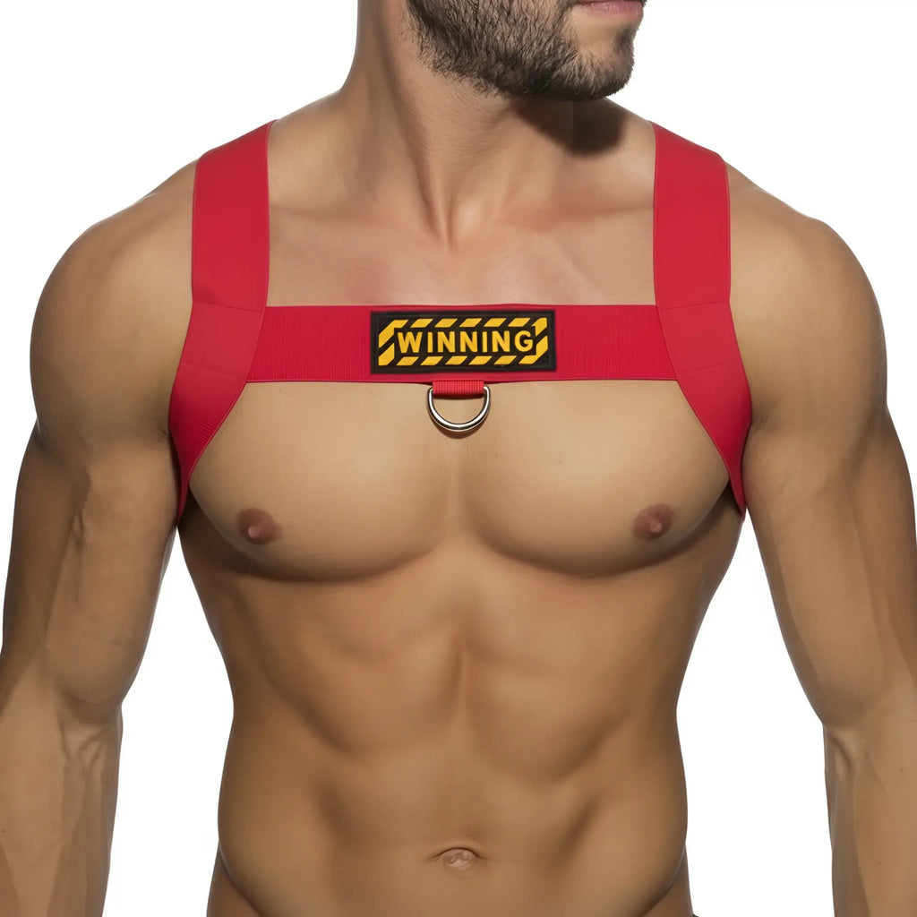 Red elastic fabric harness with black and yellow winning patch and silver metal ring from metromalewear