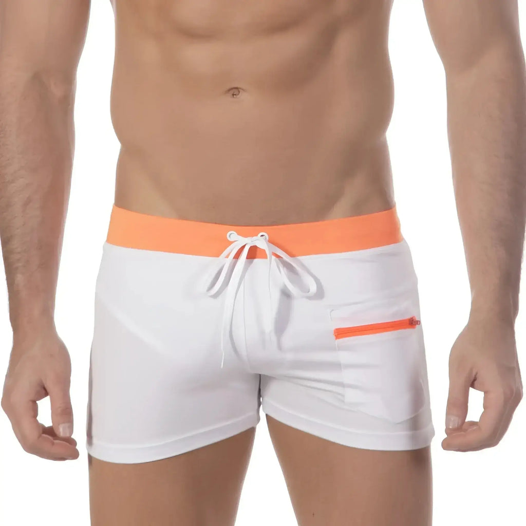 White swim trunks with bright orange waistband and zipper pocket featuring white drawstrings metro malewear zip swim boxer