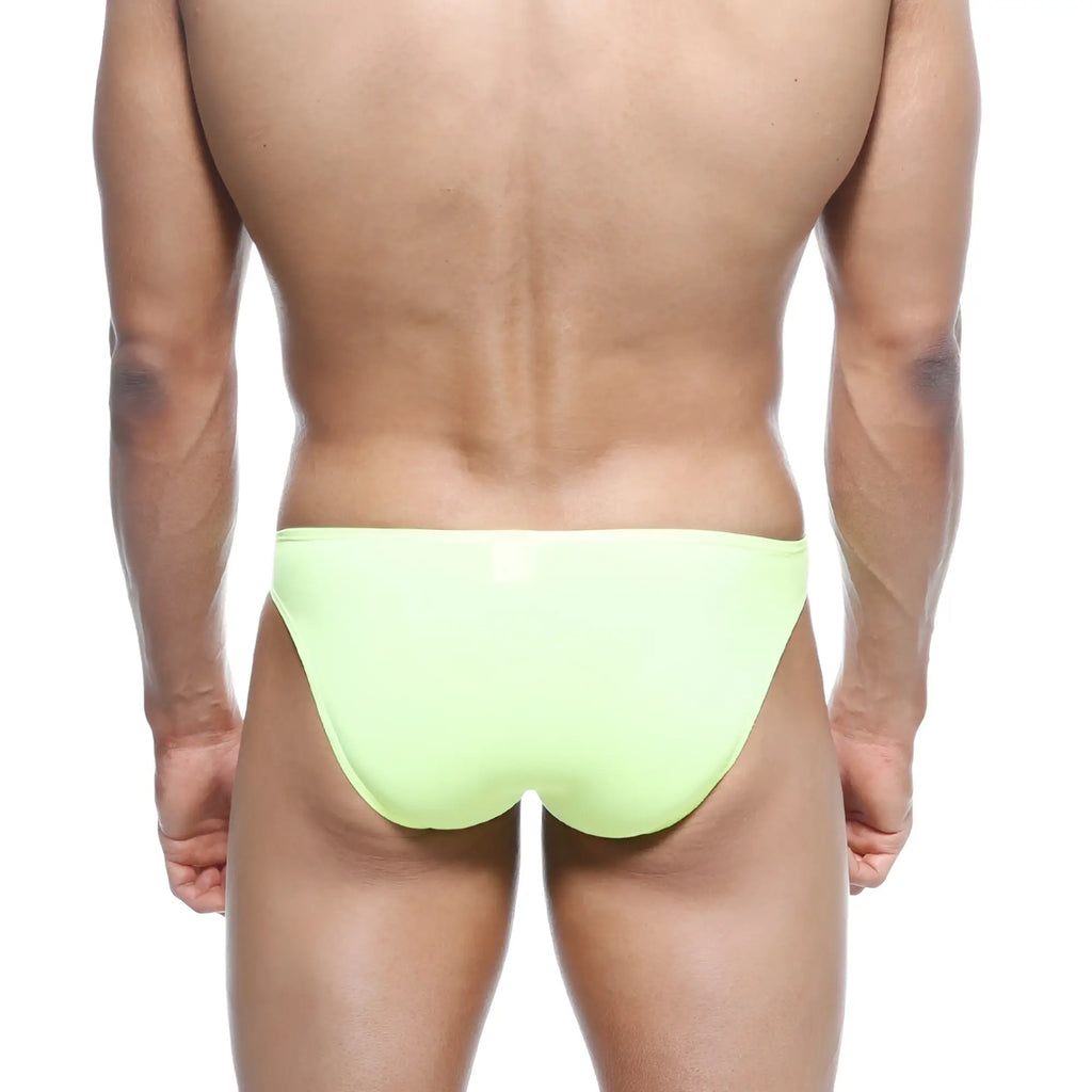 A sleek neon lime metroMalewear max bulge bikini brief swimsuit with smooth form fitting design in neon green